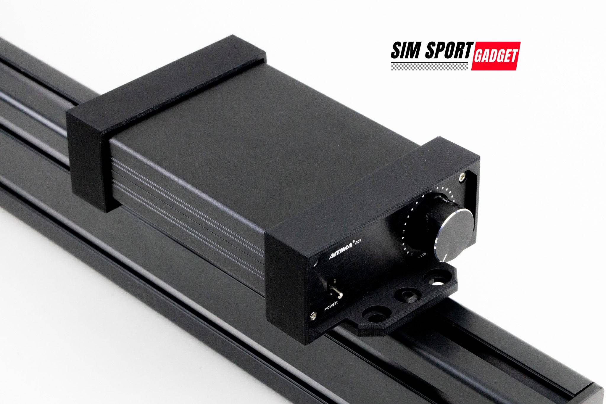 SimSportGadget AIYIMA A07 amplifier bracket mounted on a sim racing aluminum rig for power brick support.
