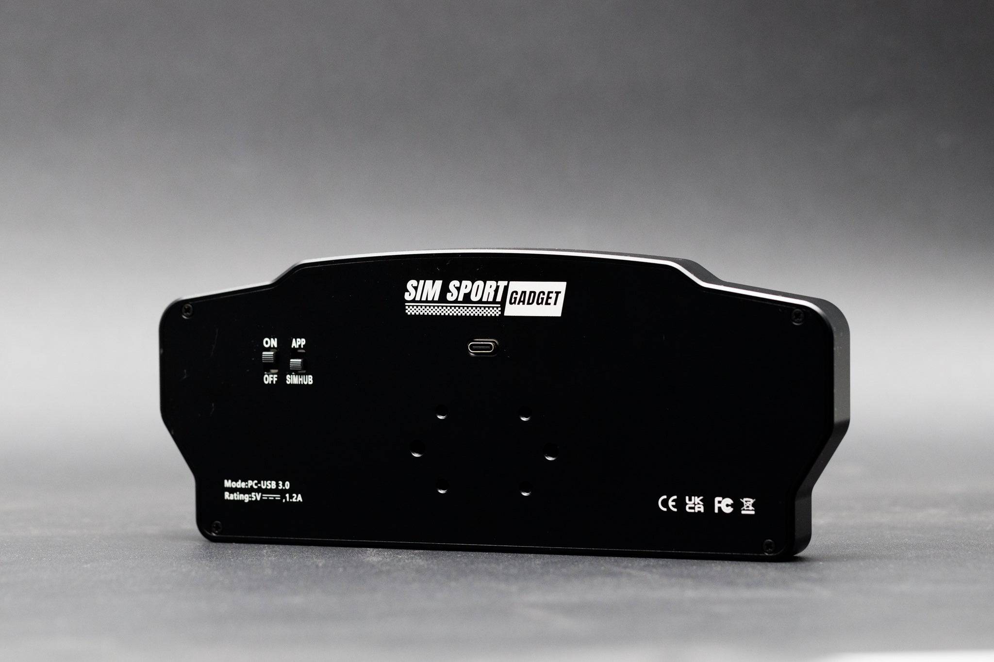 Electronic SSG Dashboard Display DV-8 by SimSportGadget showing digital interface and control buttons on a sleek display panel.