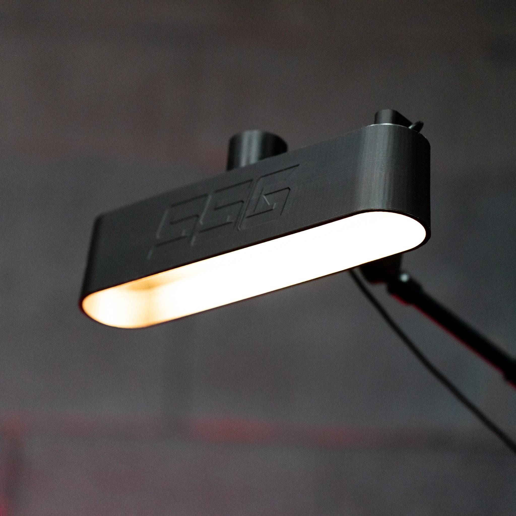 SimSportGadget Philips Hue Play Bar shade diffuser cover mounted on light mount, diffusing light for a softer glow.