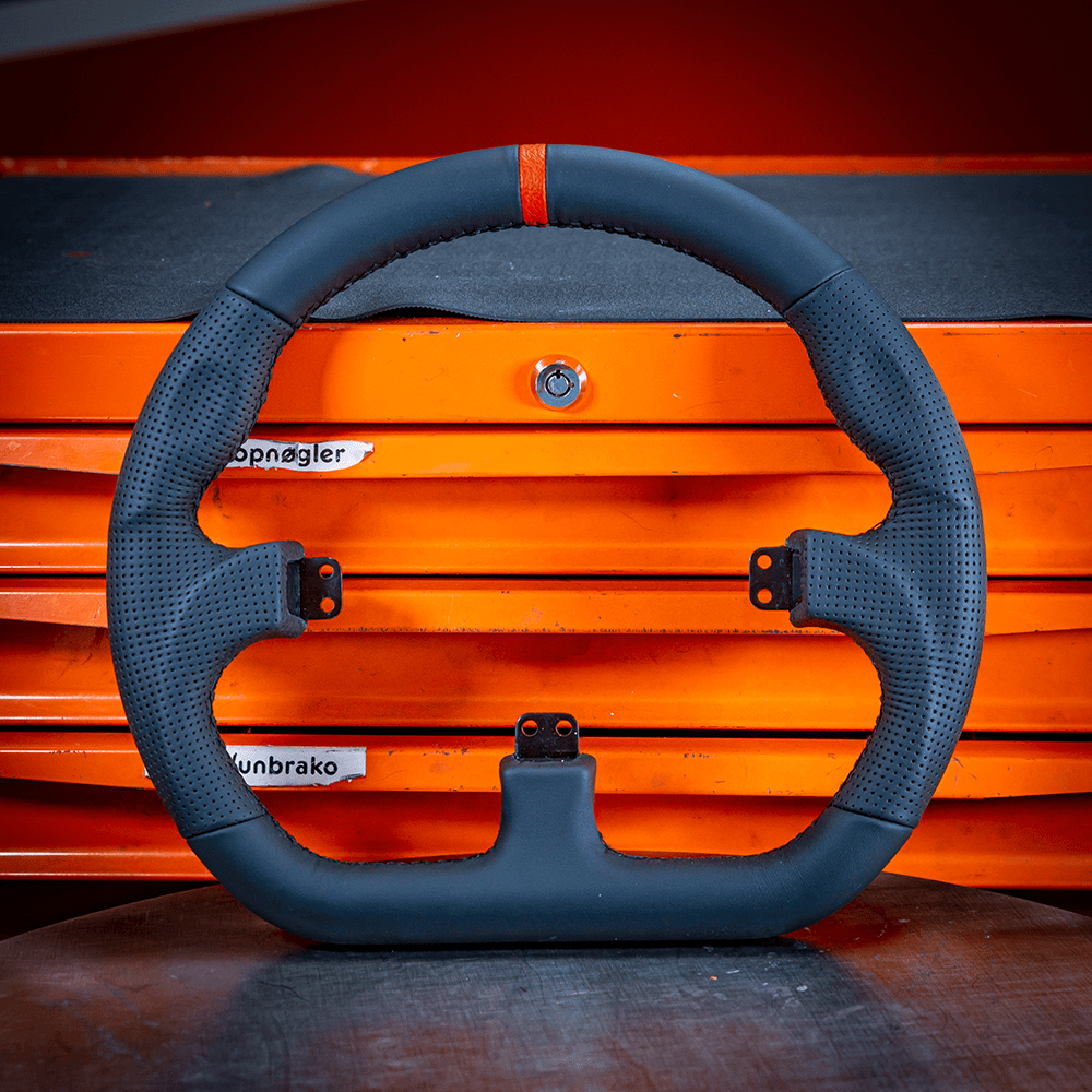 Asetek SimSports GT Wheel Rim in black leather with a red center stripe, designed for sim racing wheel accessories.