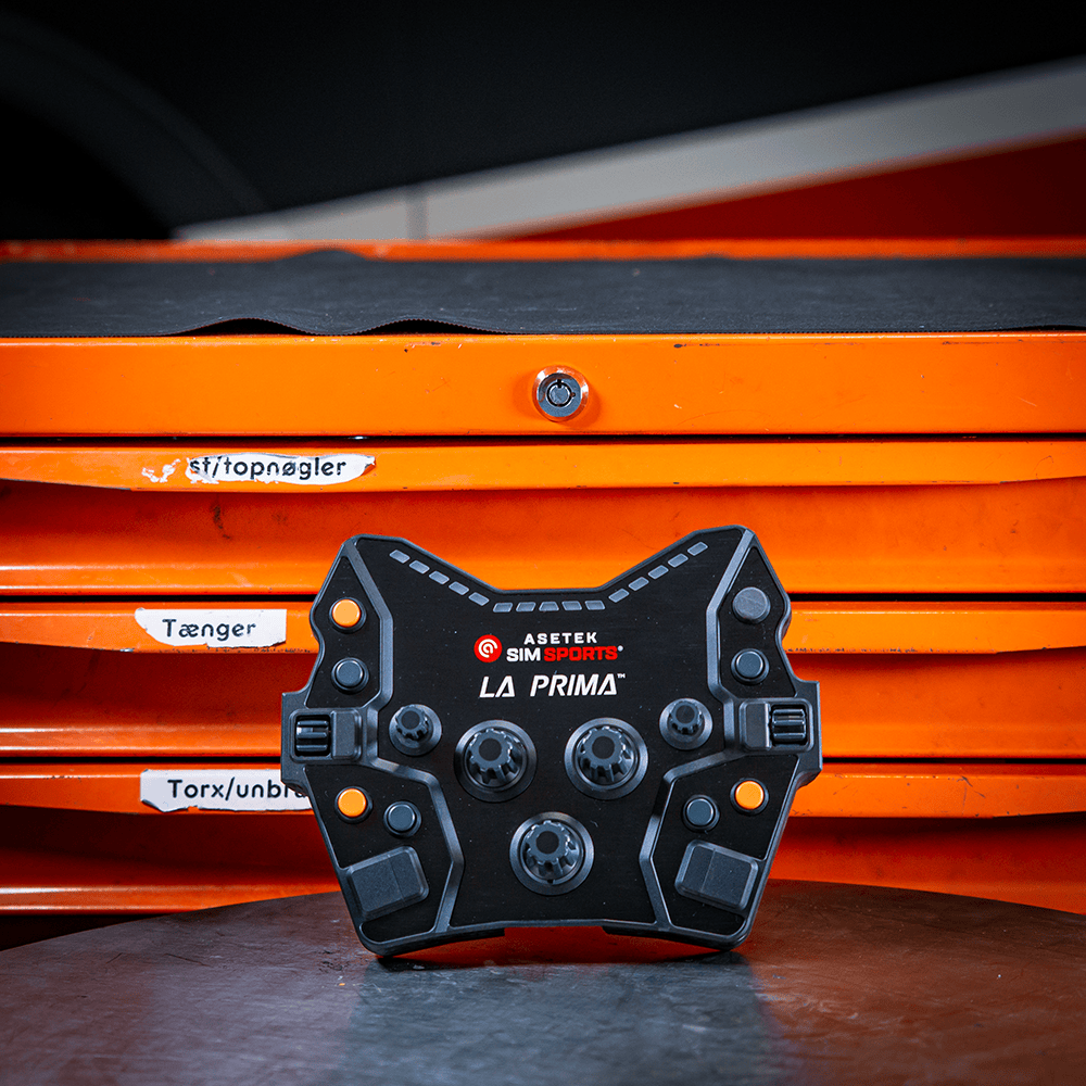 Asetek SimSports La Prima Button Box wheel rim accessory with multiple buttons and switches for sim racing setups.