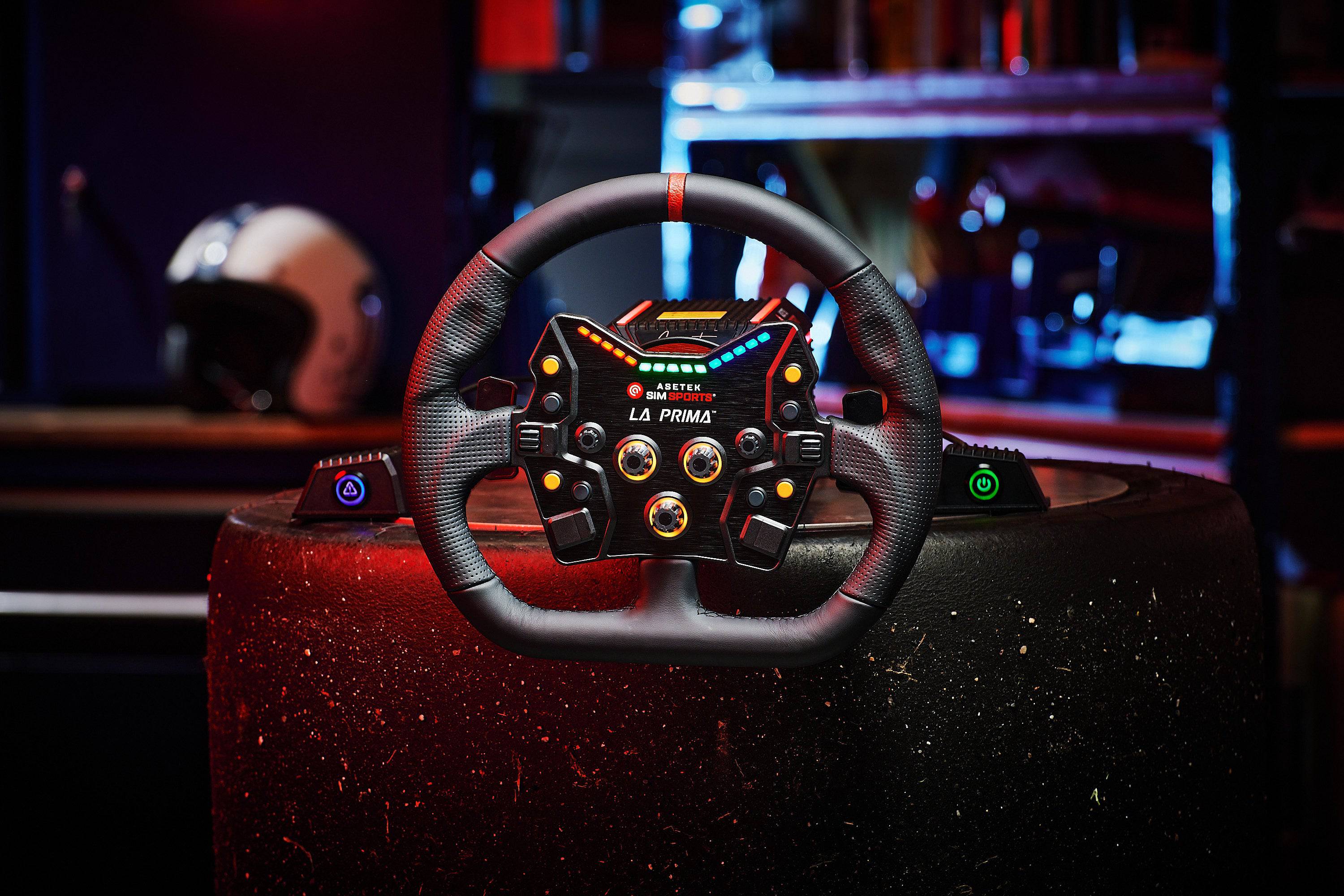 Asetek SimSports La Prima button box with black perforated leather handles and red center stripe for wheel rim accessories.