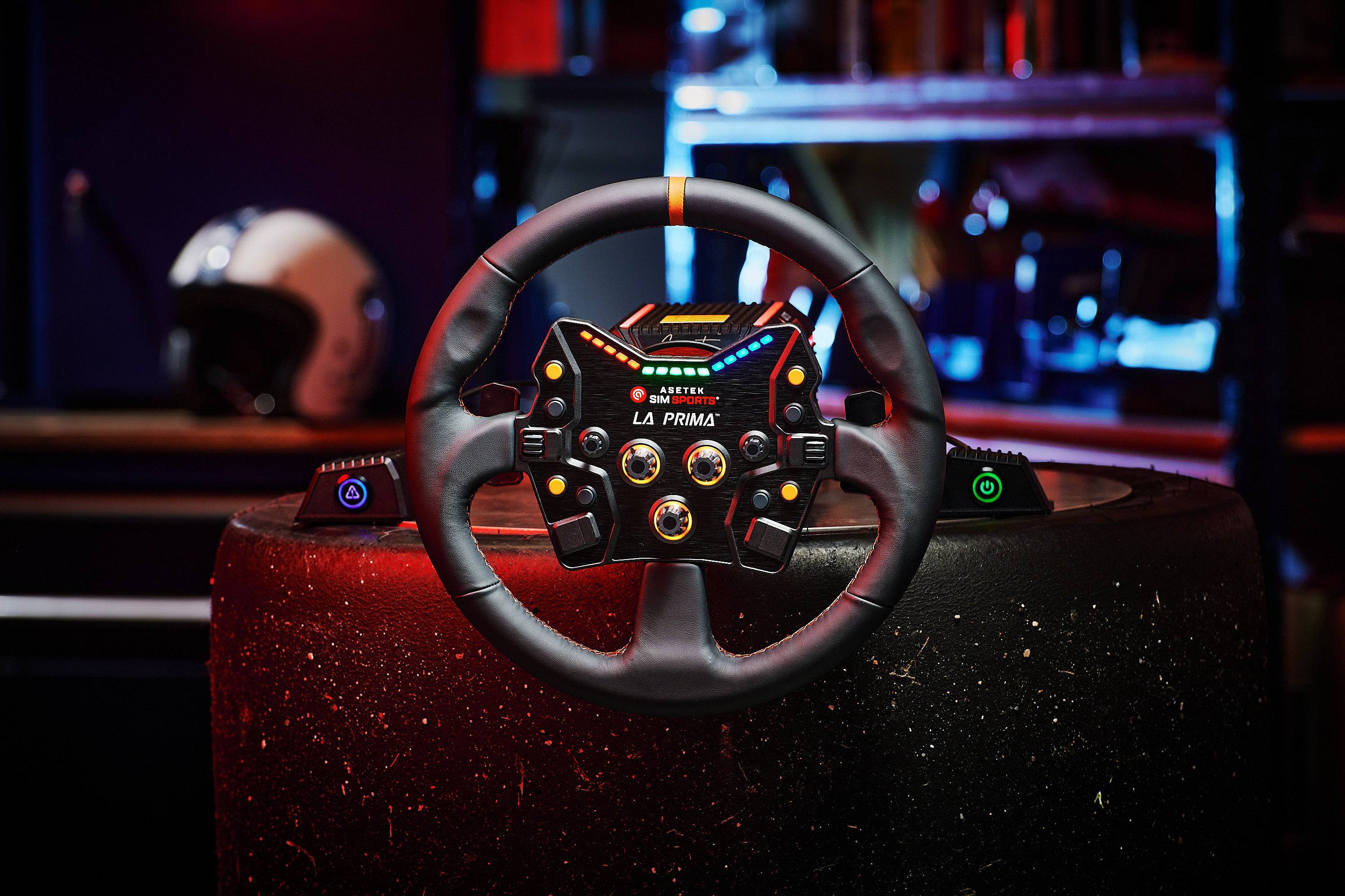 Asetek SimSports La Prima wheel rim accessory with black leather, orange center stripe, designed for simulation racing setups.
