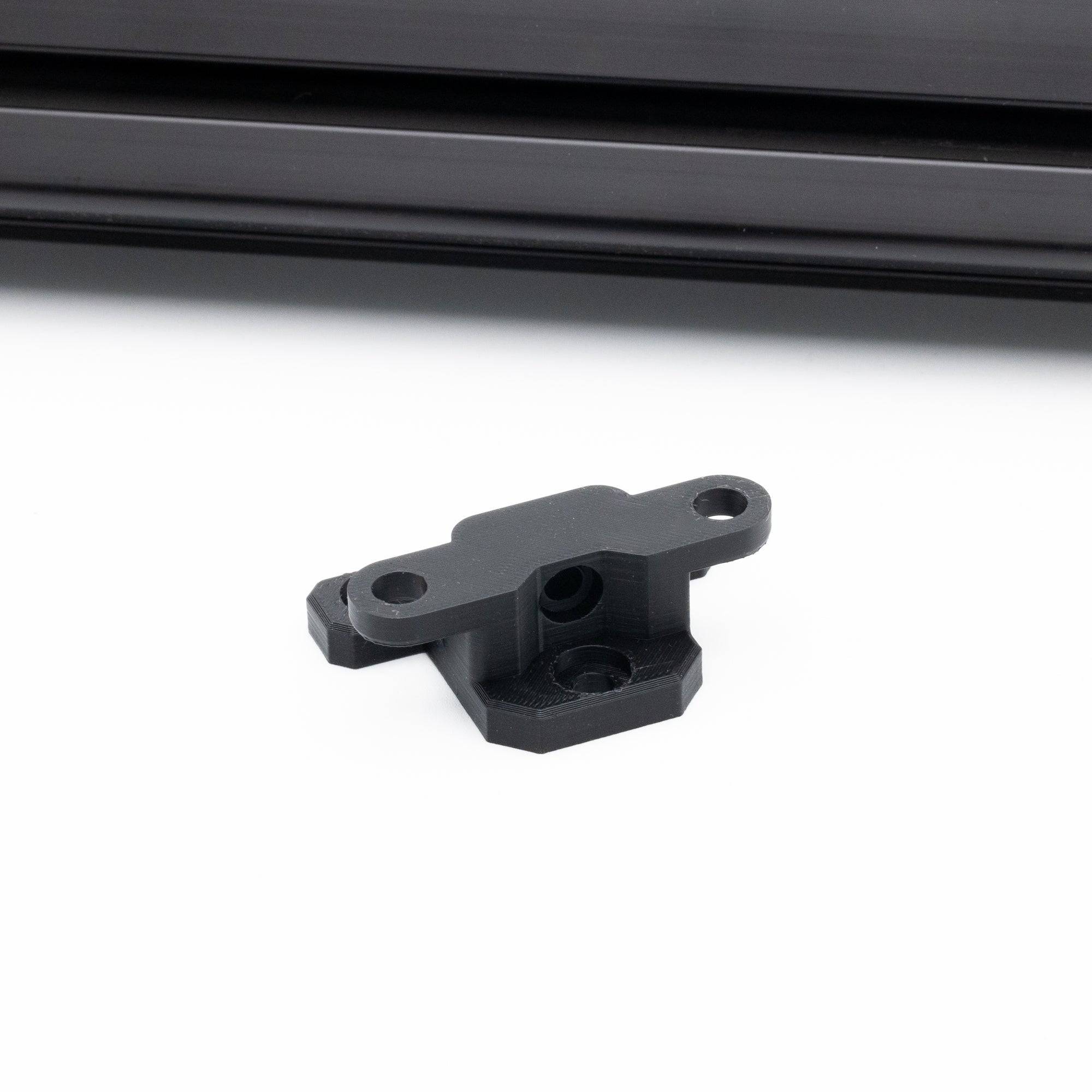 SimSportGadget Buchfink Q1R steering wheel mount for sim racing, wall-mounted bracket with sturdy construction and mounting hardware.