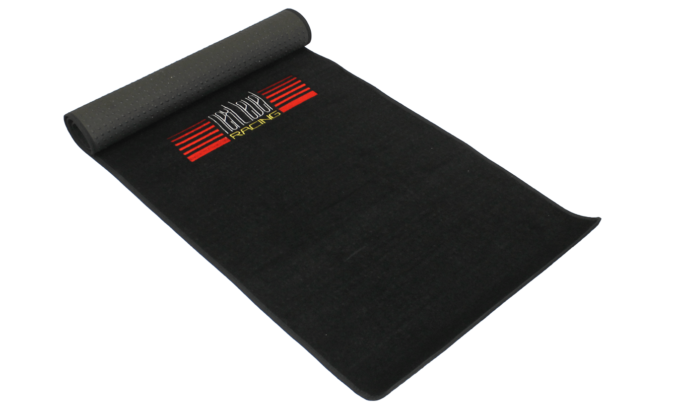 Next Level Racing Floor Mat accessory, black rubber mat designed to protect flooring and provide stability during racing simulation.