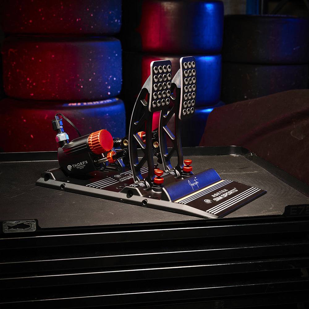 Asetek SimSports Invicta™ Pedals T.H.O.R.P.™ II set with metal footplates and adjustable pedal tension, designed for racing simulators.