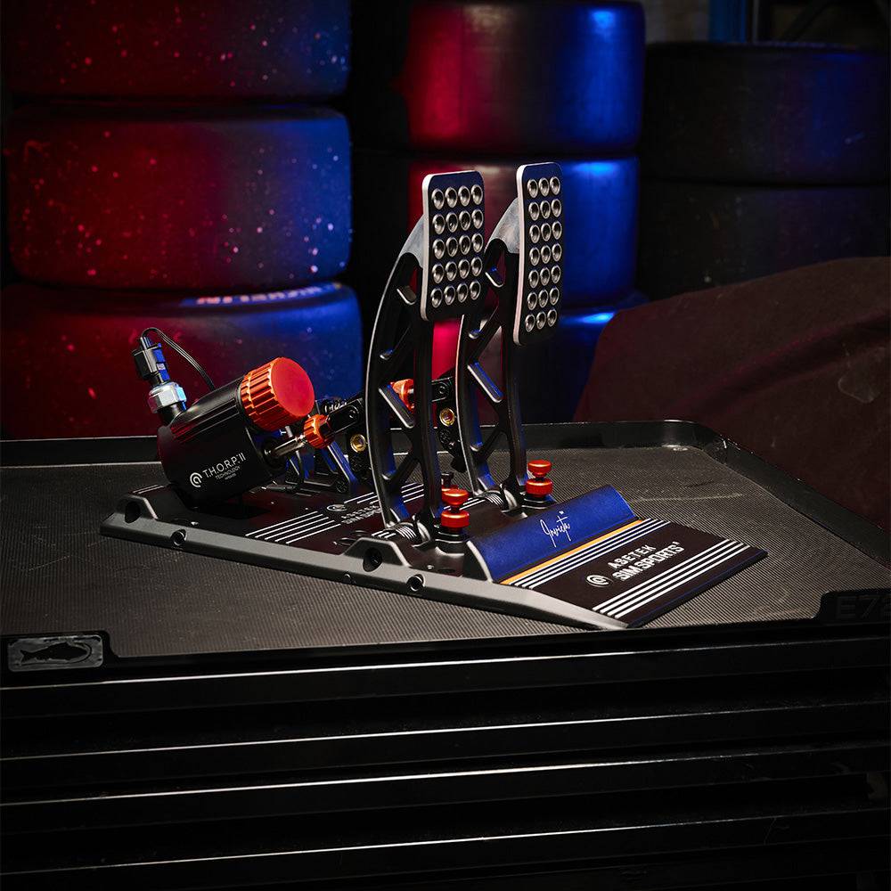 Asetek SimSports Invicta™ Pedals T.H.O.R.P.™ II showing black metal pedals with textured footplates and sturdy design for racing simulation.