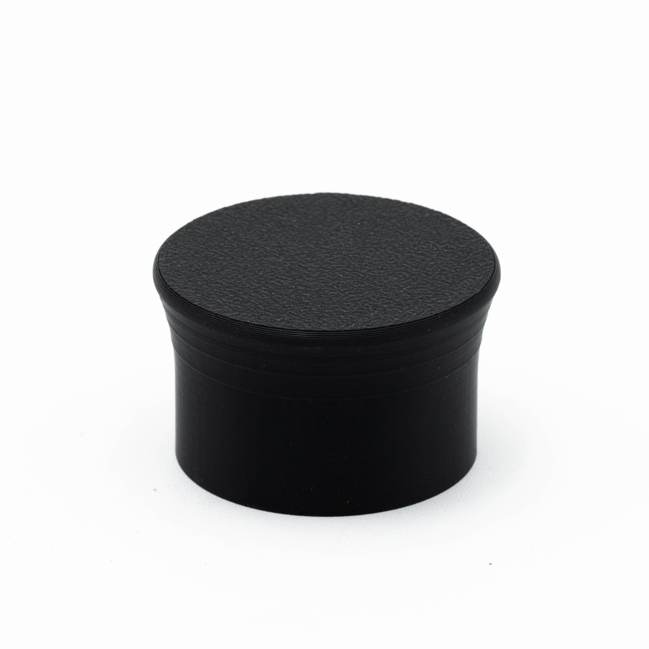 Dust cover for NRG wheel base quick release, black accessory mount with snug fit, designed to protect and enhance NRG wheel base setup.