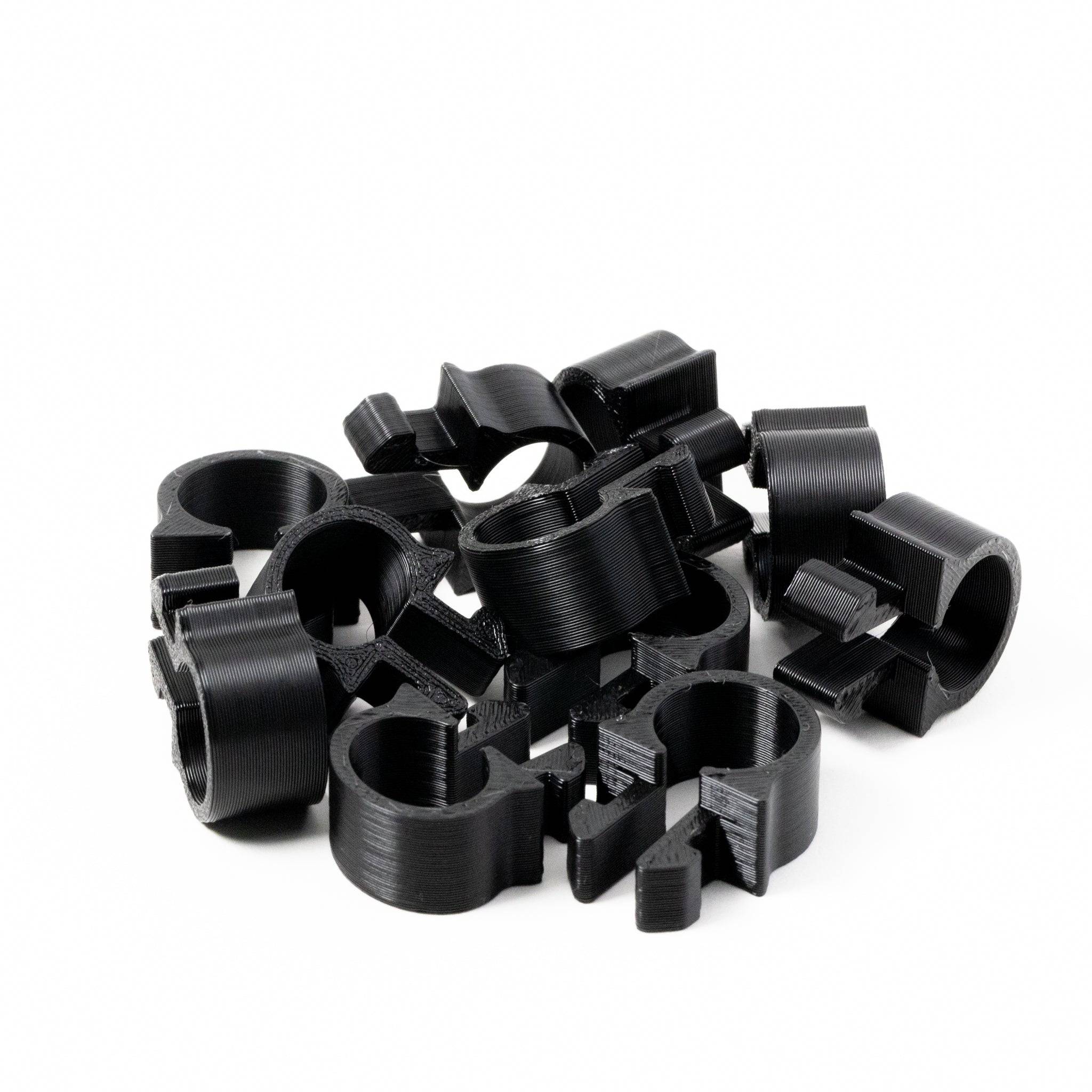 SimSportGadget cable management clip for 1515 rigs, shown attached to organize and secure cables effectively.