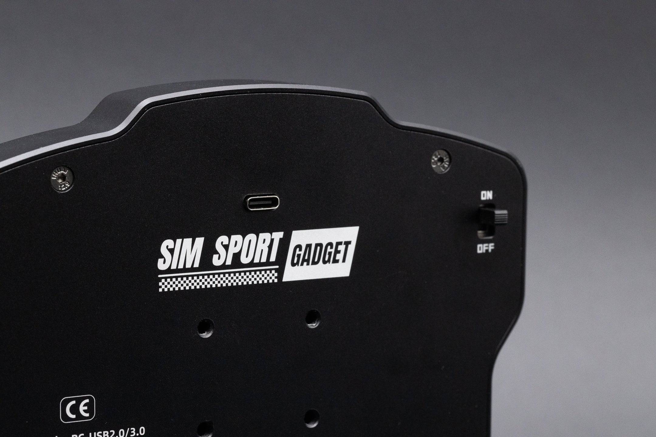 SimSportGadget SSG Dashboard Display DV-5 button box with digital dashes for racing simulators, featuring multiple control buttons and a sleek design.