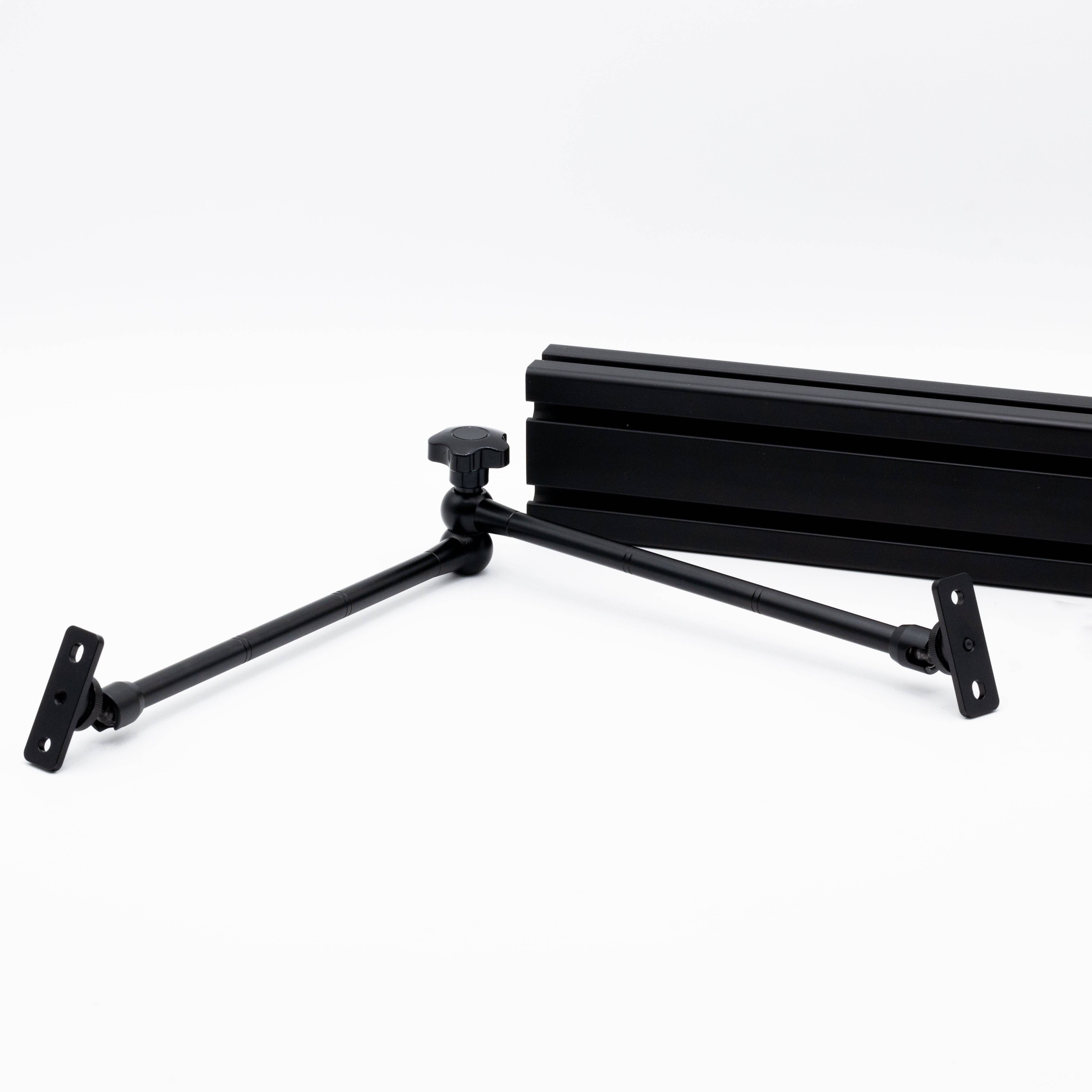 SimSportGadget SSG premium articulating arm mounted on a sim rig for adjustable monitor positioning.