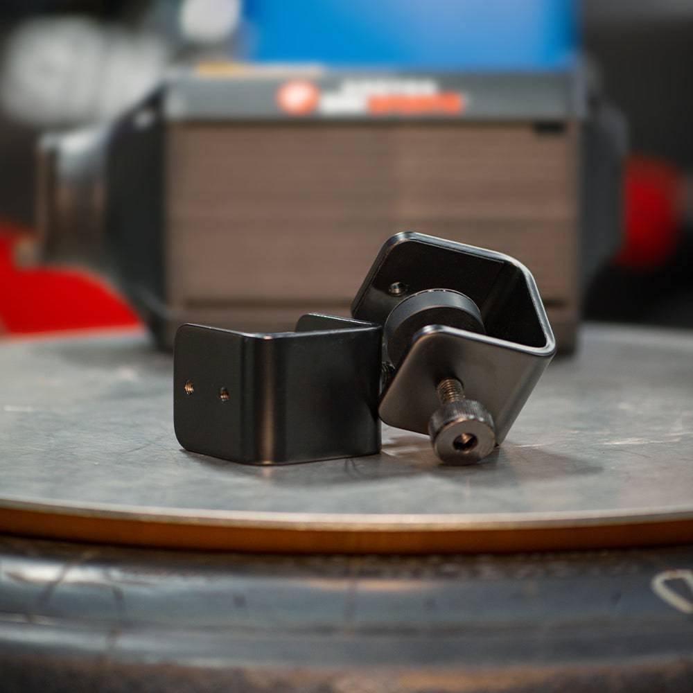 Asetek SimSports bottom mount with table clamps, shown attached to a desk for secure gaming or simulation setup.