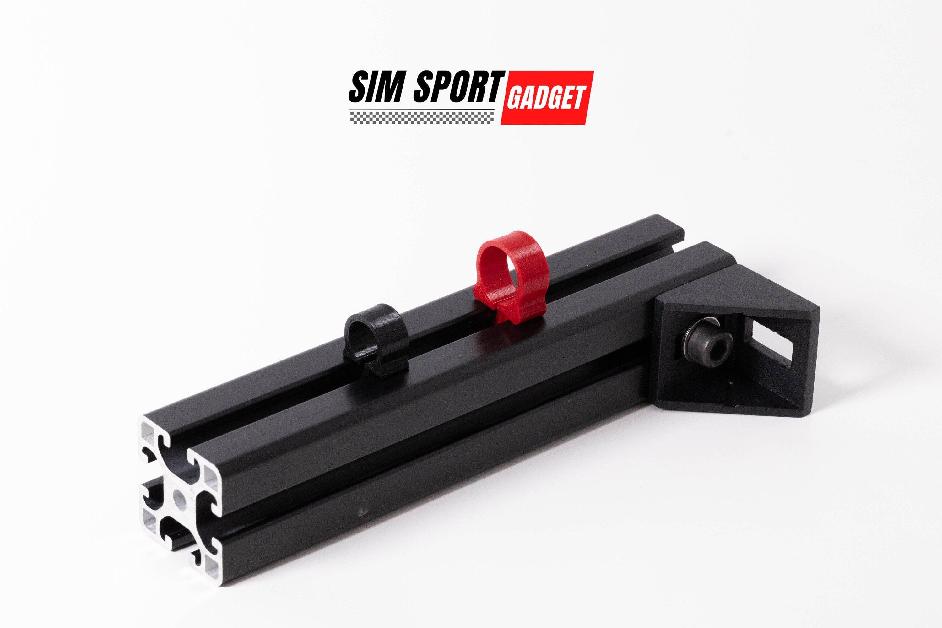 SimSportGadget SNUG Cable Management Clip securing cables neatly on a desk or wall for organized setup.