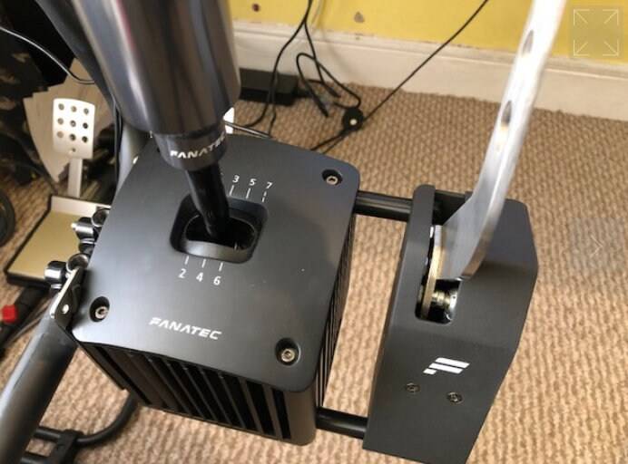 SimSportGadget wheel mounting spacer for Fanatec shifter and handbrake, designed to securely attach accessories to gaming wheel setups.