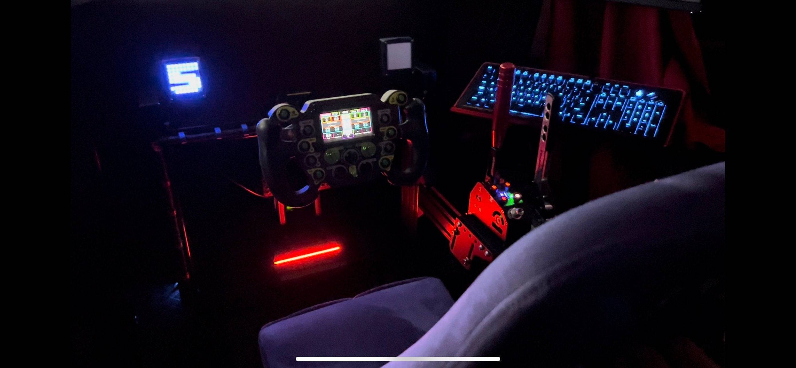 SimSportGadget iFlag Matrix Display button box and dashes with colorful LED lights on a black background.