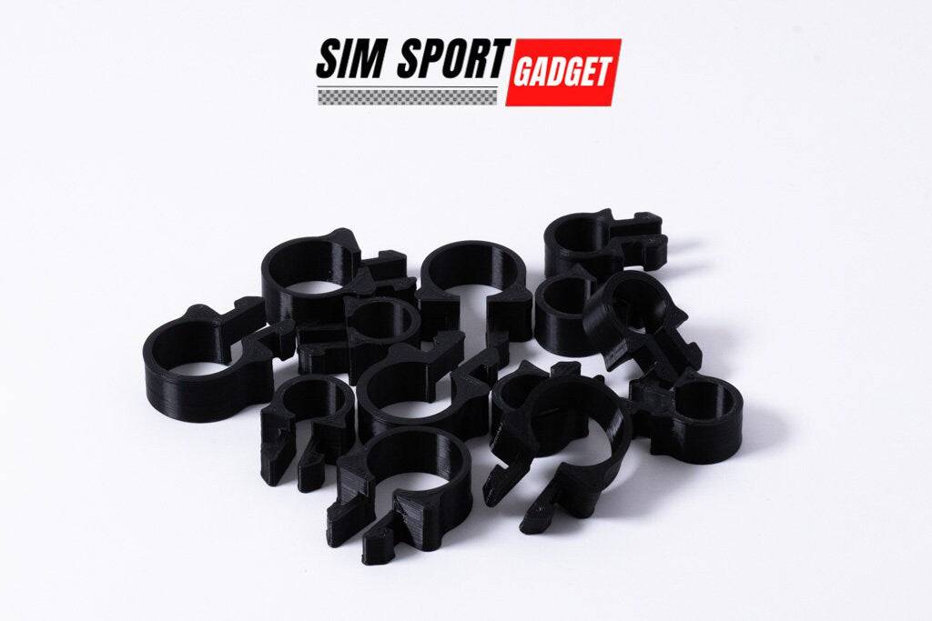 SimSportGadget SNUG Cable Management Clip securing and organizing cables neatly on a surface.