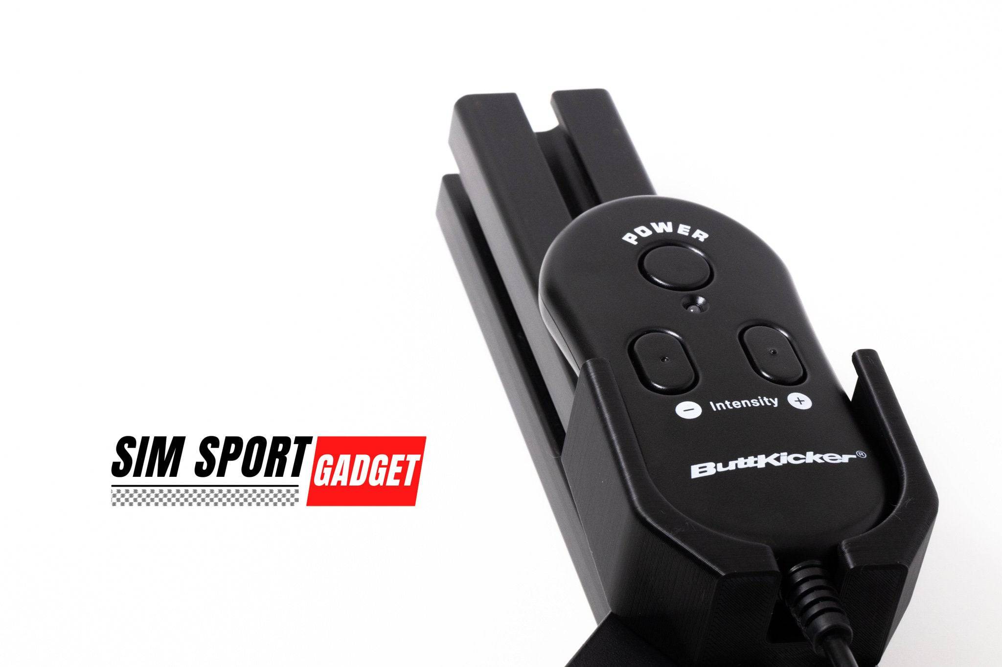 SimSportGadget Buttkicker Remote Mount accessory installed on a gaming setup for vibration feedback.