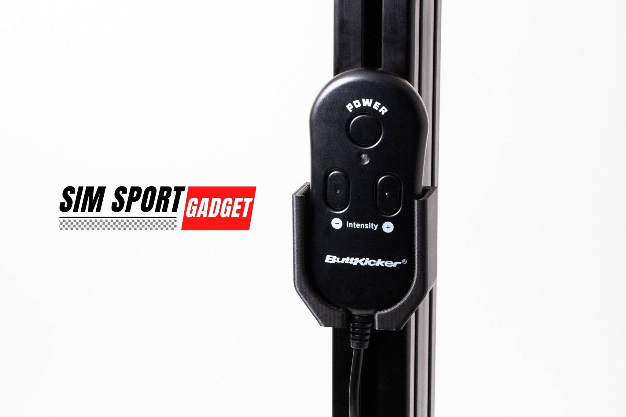 SimSportGadget Buttkicker remote mount accessory attached to a gaming setup for immersive vibration experience.