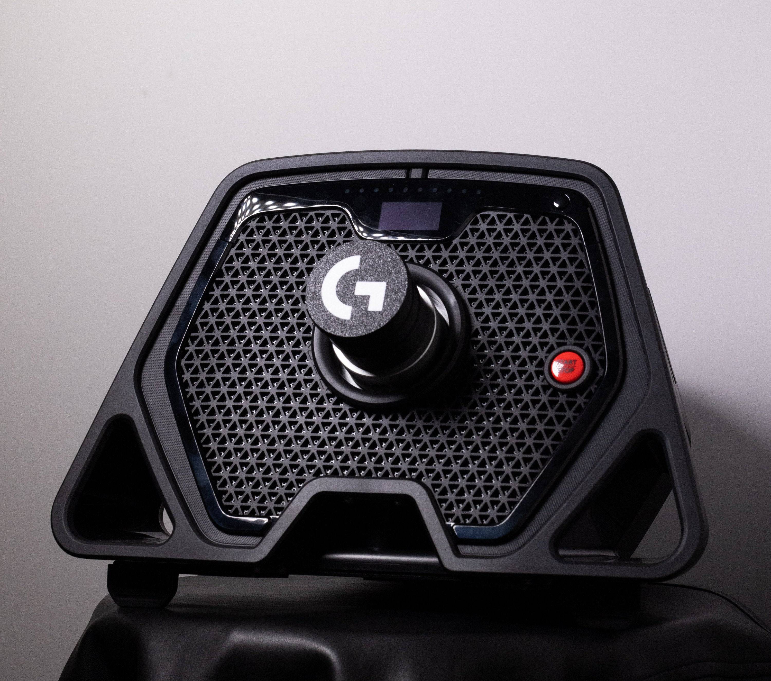 Dust cover for Logitech Pro Racing quick release wheel mount by SimSportGadget, shown on the base side of the racing setup.
