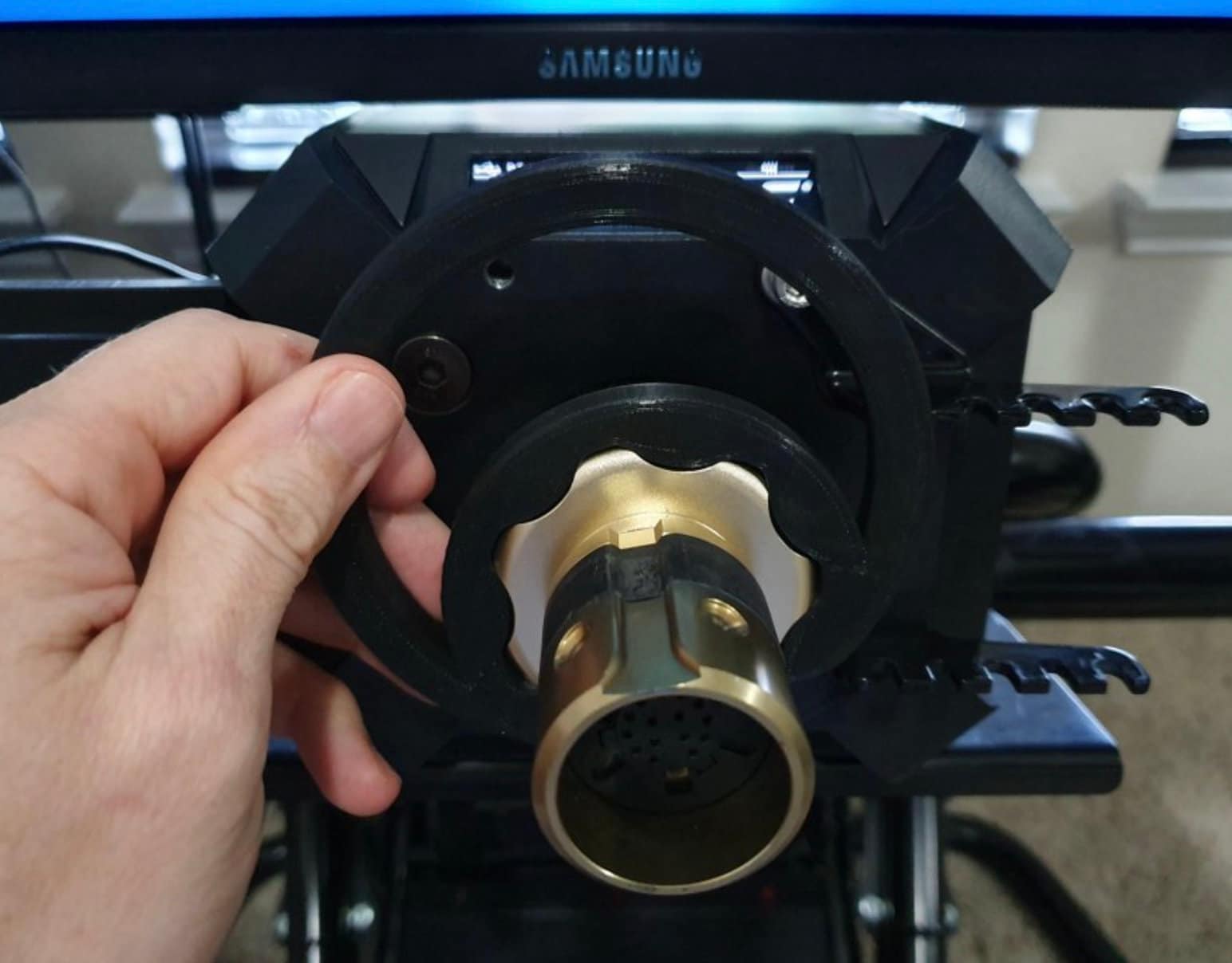 Fanatec Podium adjustment wrench by SimSportGadget, a black tool with ergonomic handle for precise gaming wheel adjustments.