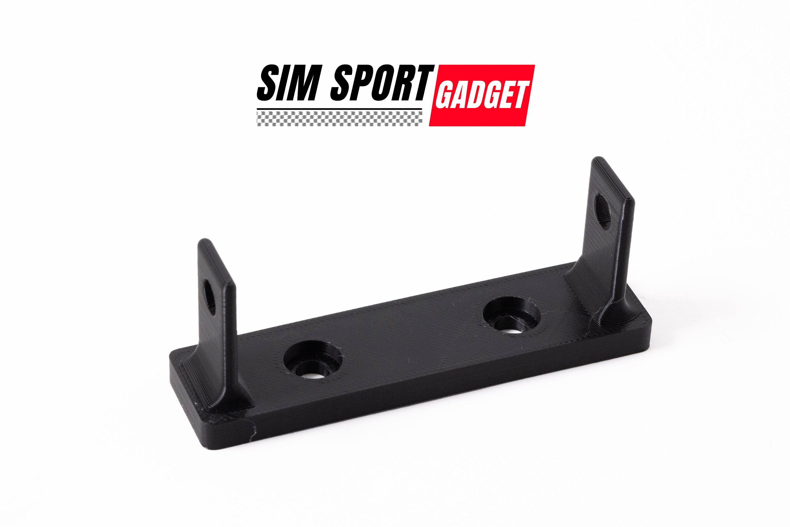 SimSportGadget Fanatec emergency stop mount accessory attached to a racing wheel setup for quick safety access.