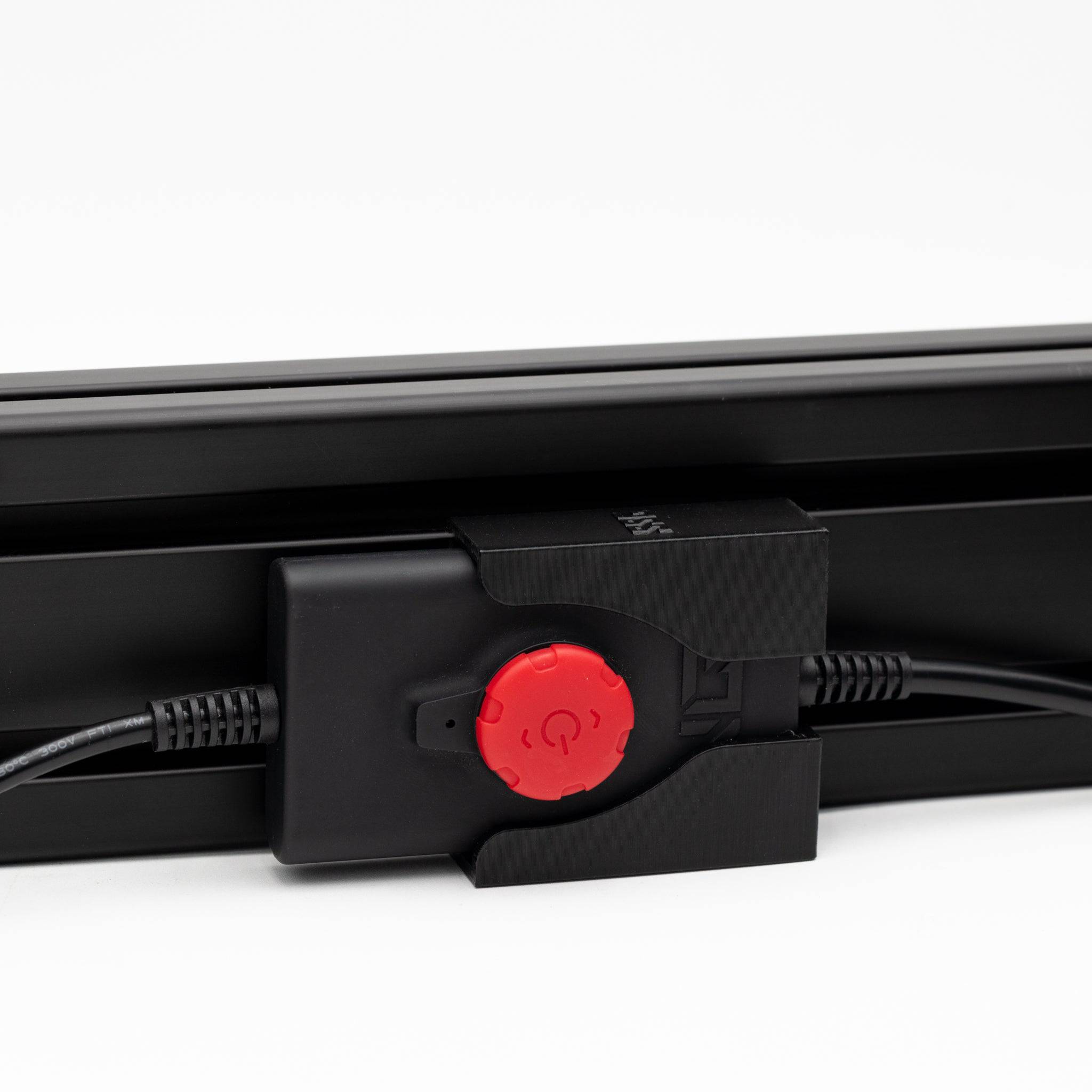 Next Level Racing HF8 Remote Mount by SimSportGadget attached to a racing simulator setup with a black remote device.