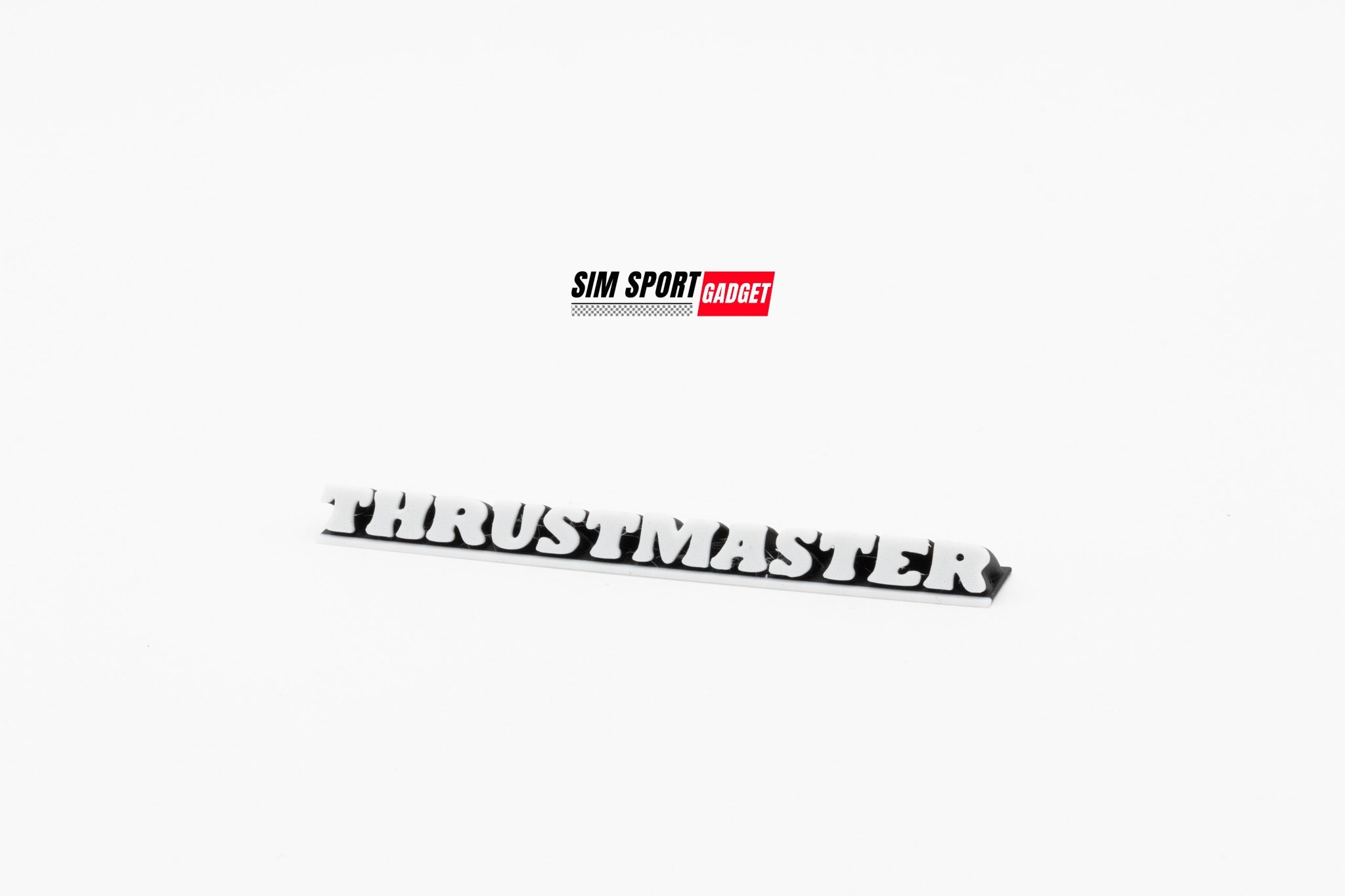 Decorative 5-inch Thrustmaster logo decor piece by SimSportGadget, featuring a sleek logo design on a smooth surface.