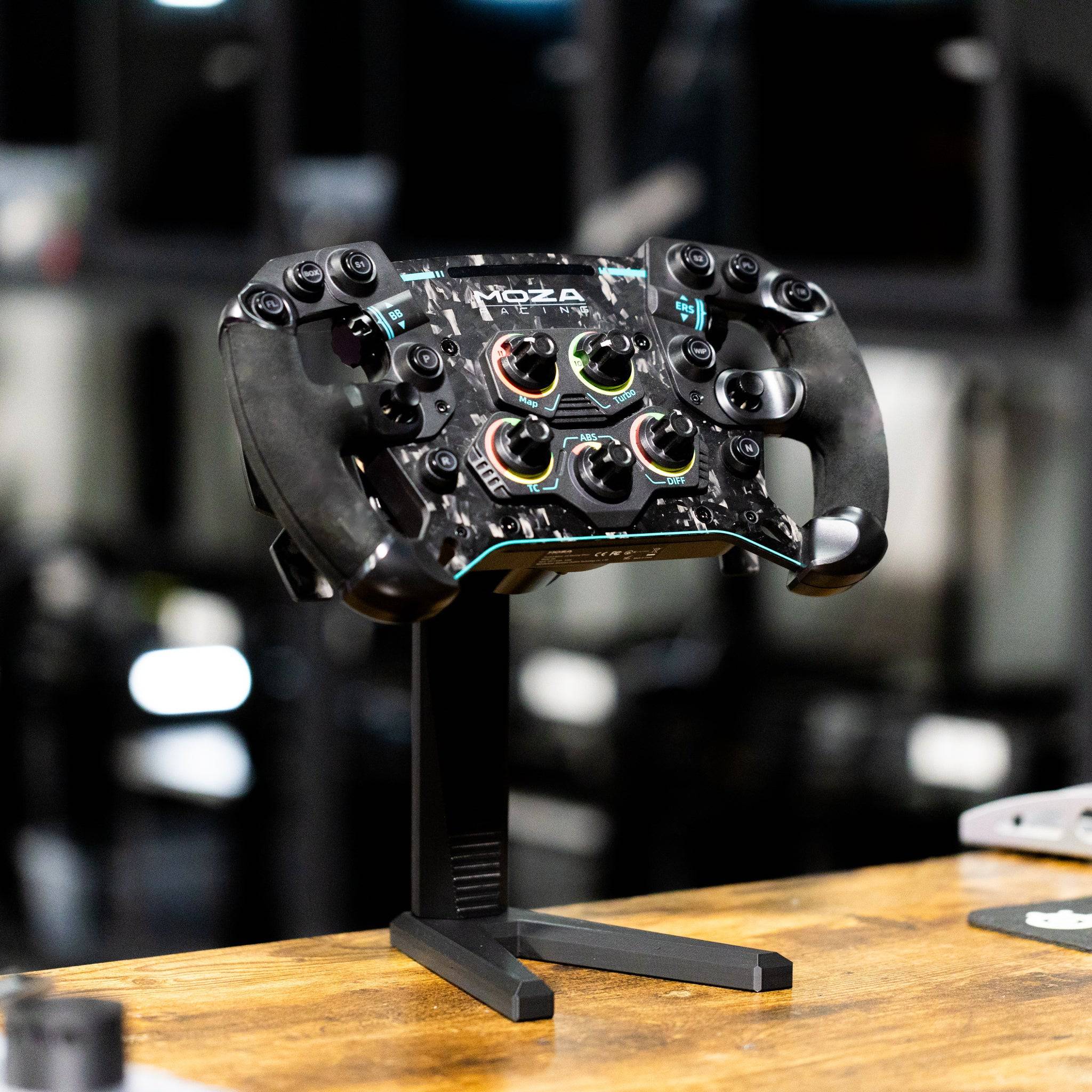 SimSportGadget wheel display stand for sim racing steering wheels, showcasing durable wheel rim accessory in black.