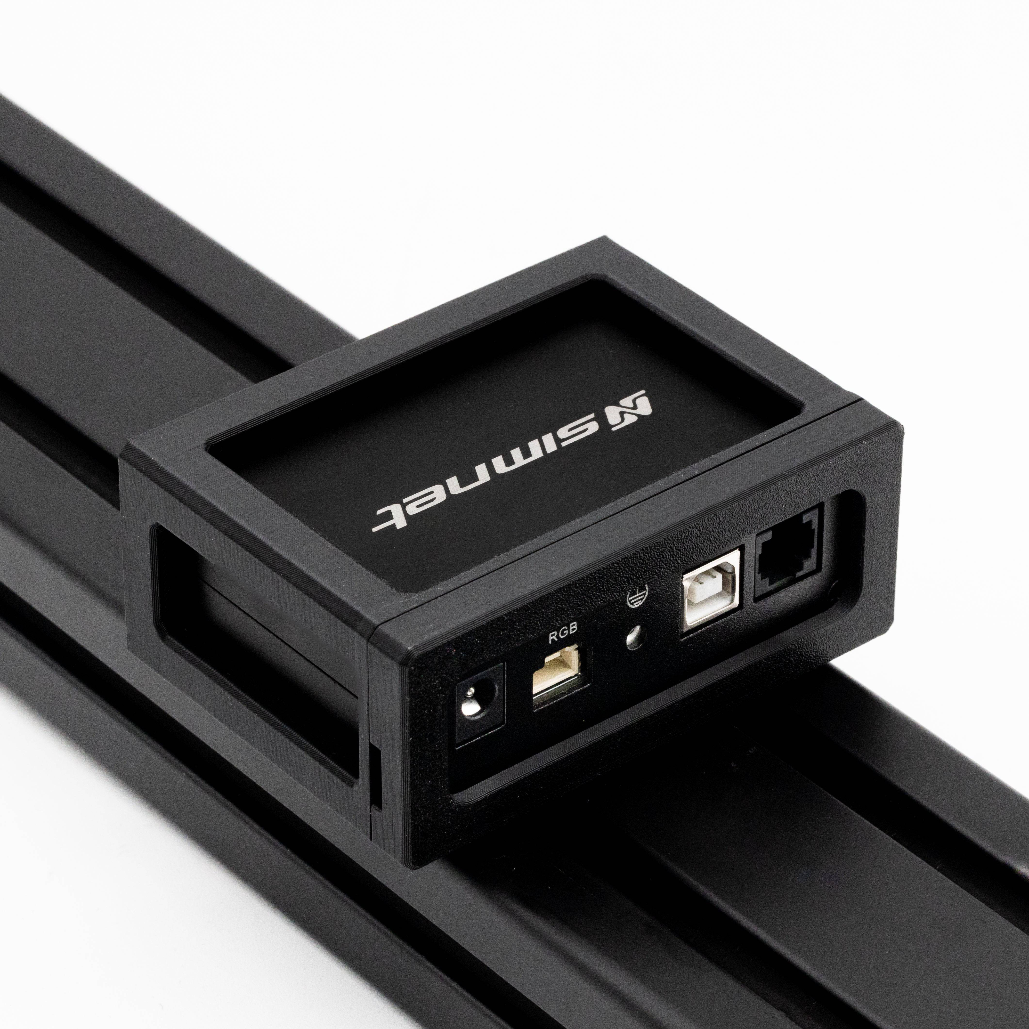 SimSportGadget SIMNET Pedal Controller Mount accessory attached to a gaming pedal setup for enhanced stability and positioning.