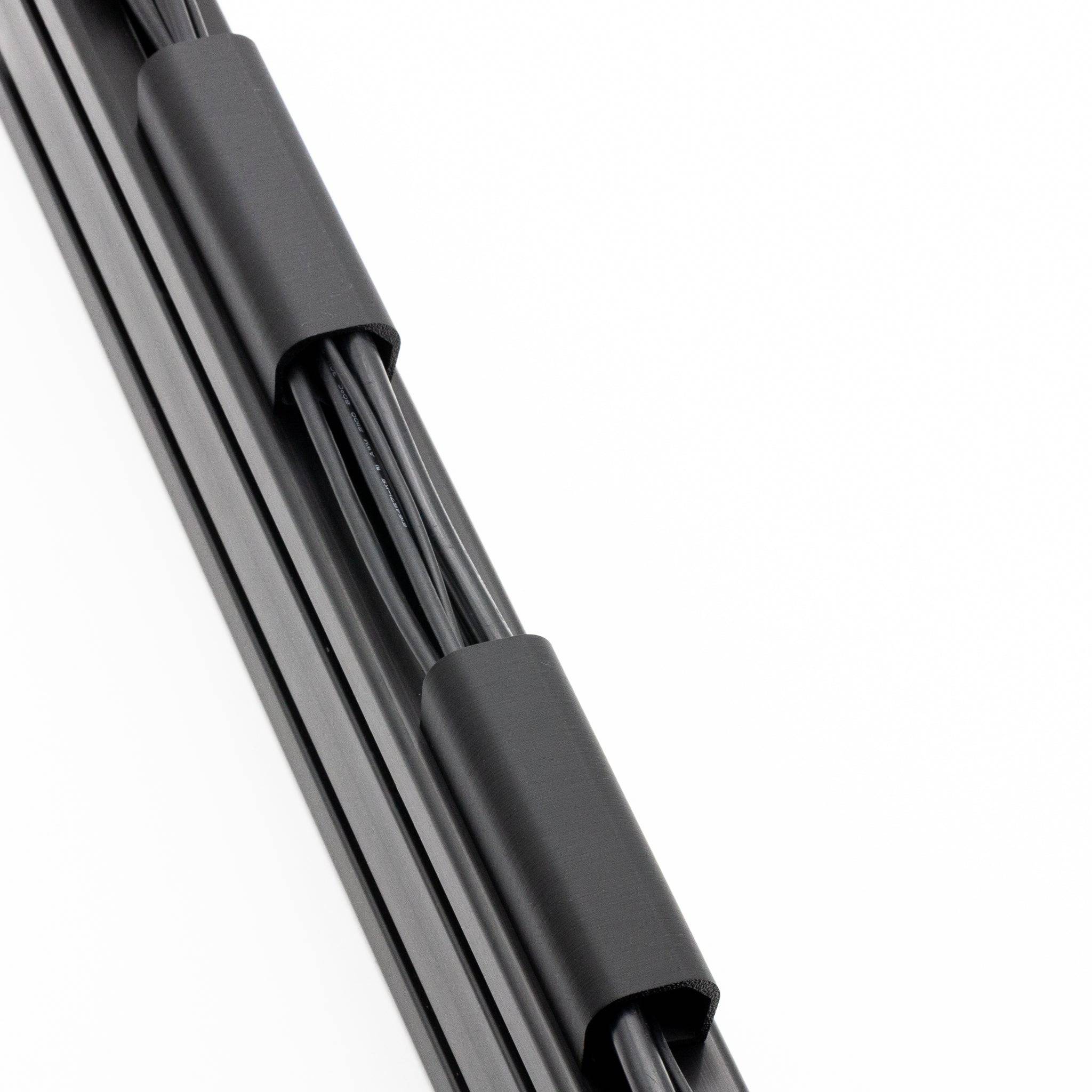 SimSportGadget cable management channel with thick cable clip for organizing and securing cables neatly in professional setups.