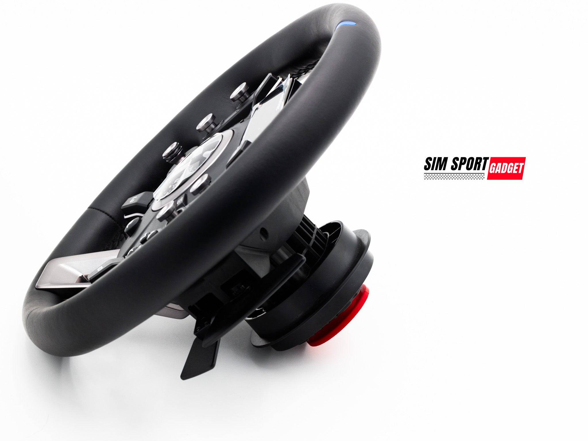 Wooden track art with a Fanatec QR2 wheel side dust cover by SimSportGadget resting on a surface.