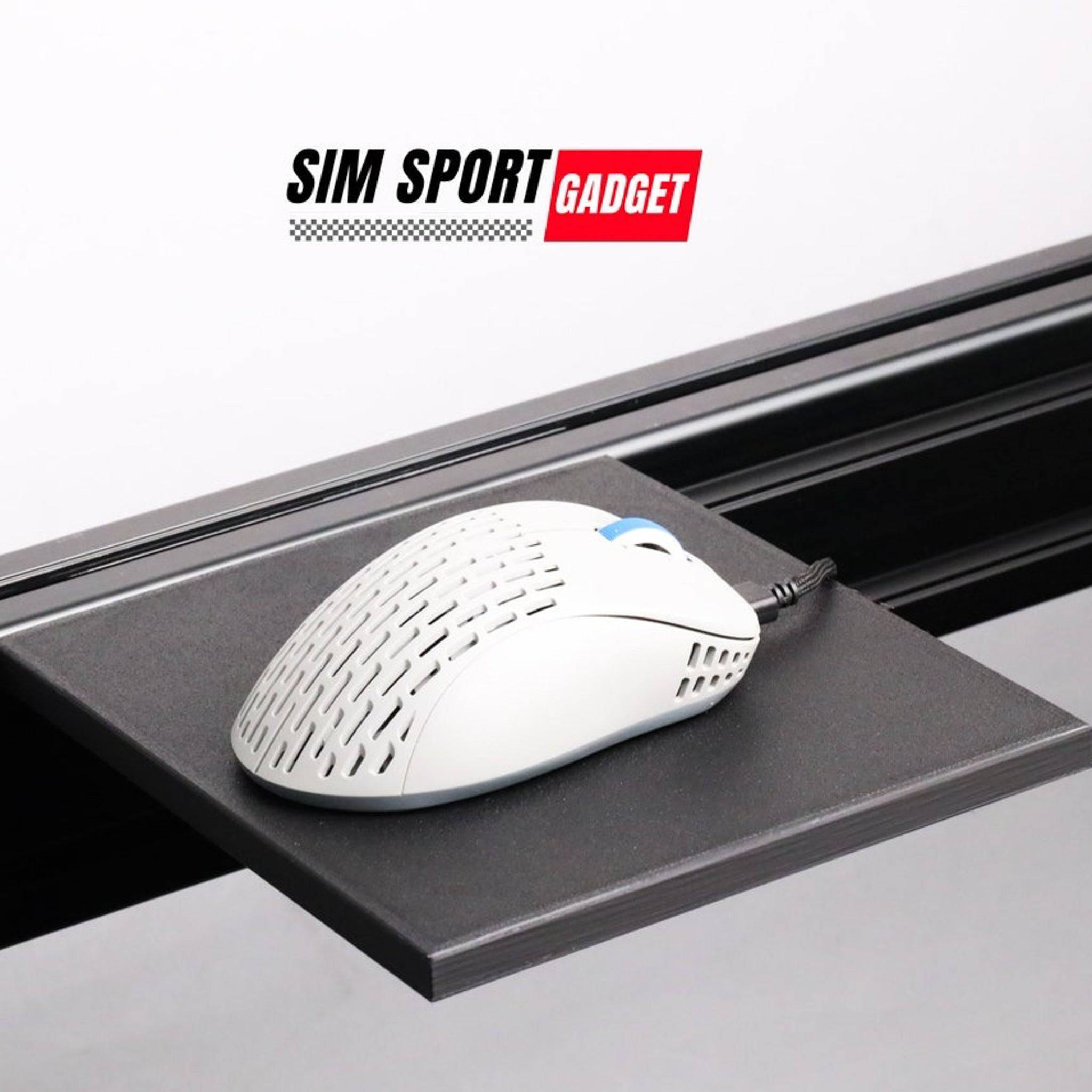 SimSportGadget sim racing mouse pad accessory with textured surface for precise control on a racing rig setup.