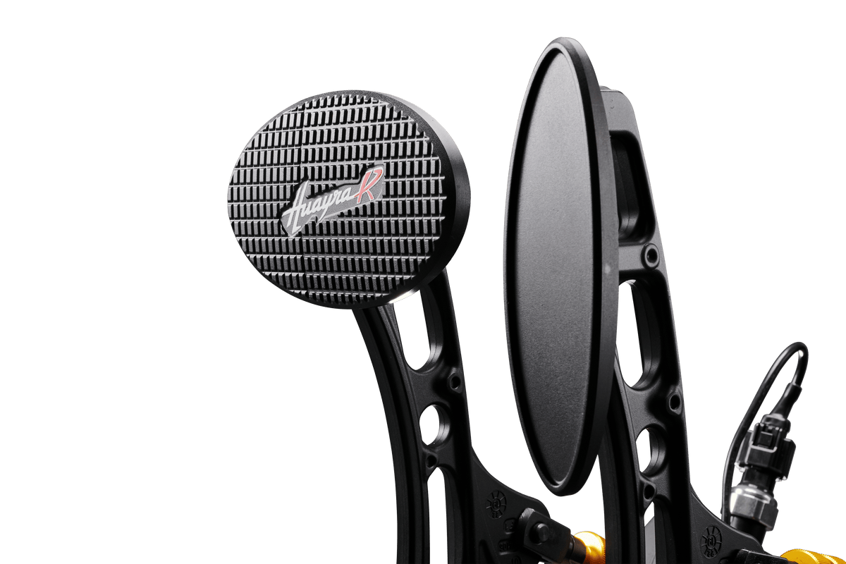 Asetek SimSports Pagani Huayra R racing pedals for sim racing setups, featuring metallic and black design with detailed pedal surfaces.