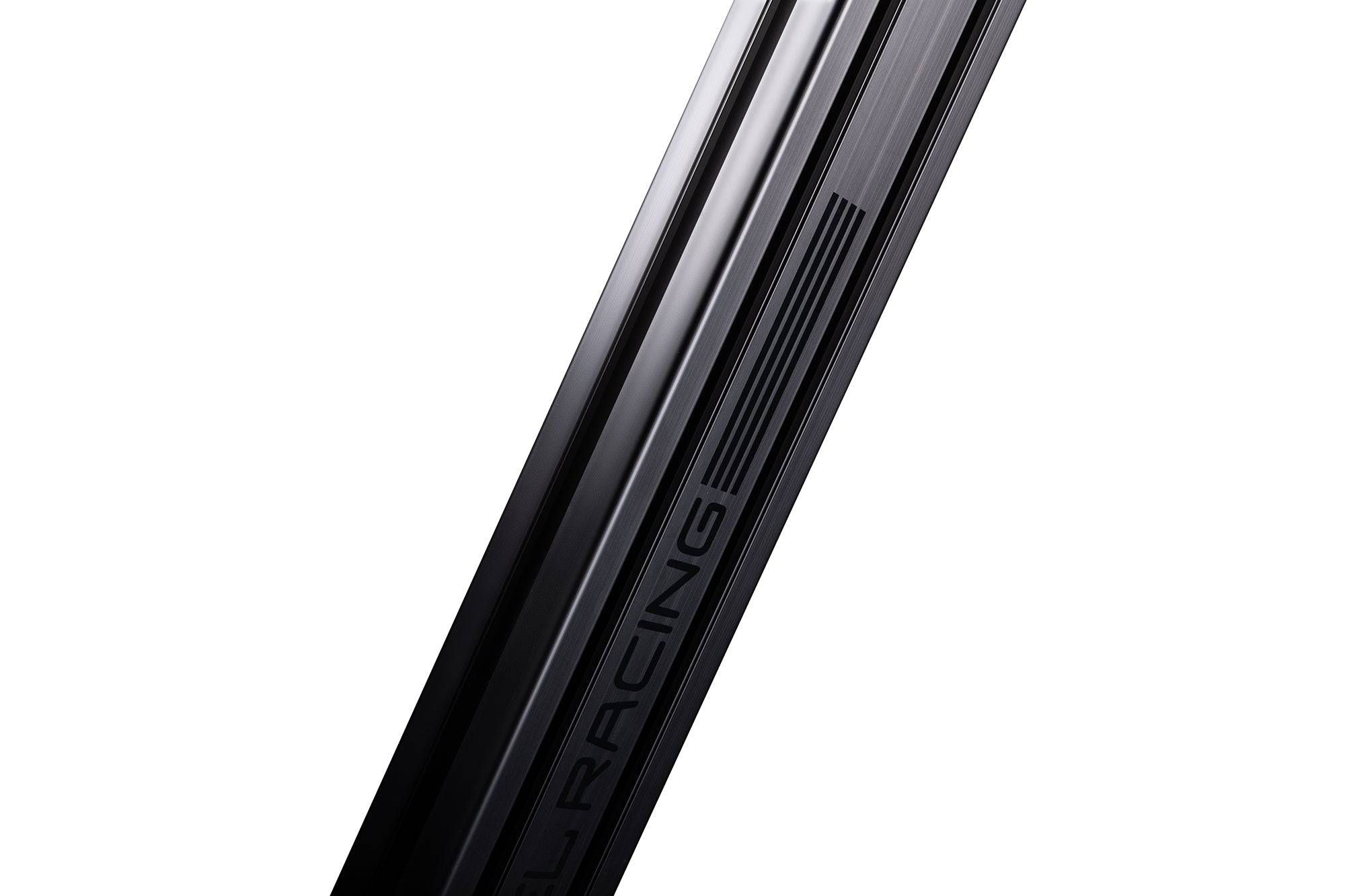 Next Level Racing Elite freestanding monitor stand in carbon grey holding a single computer monitor on a desk.