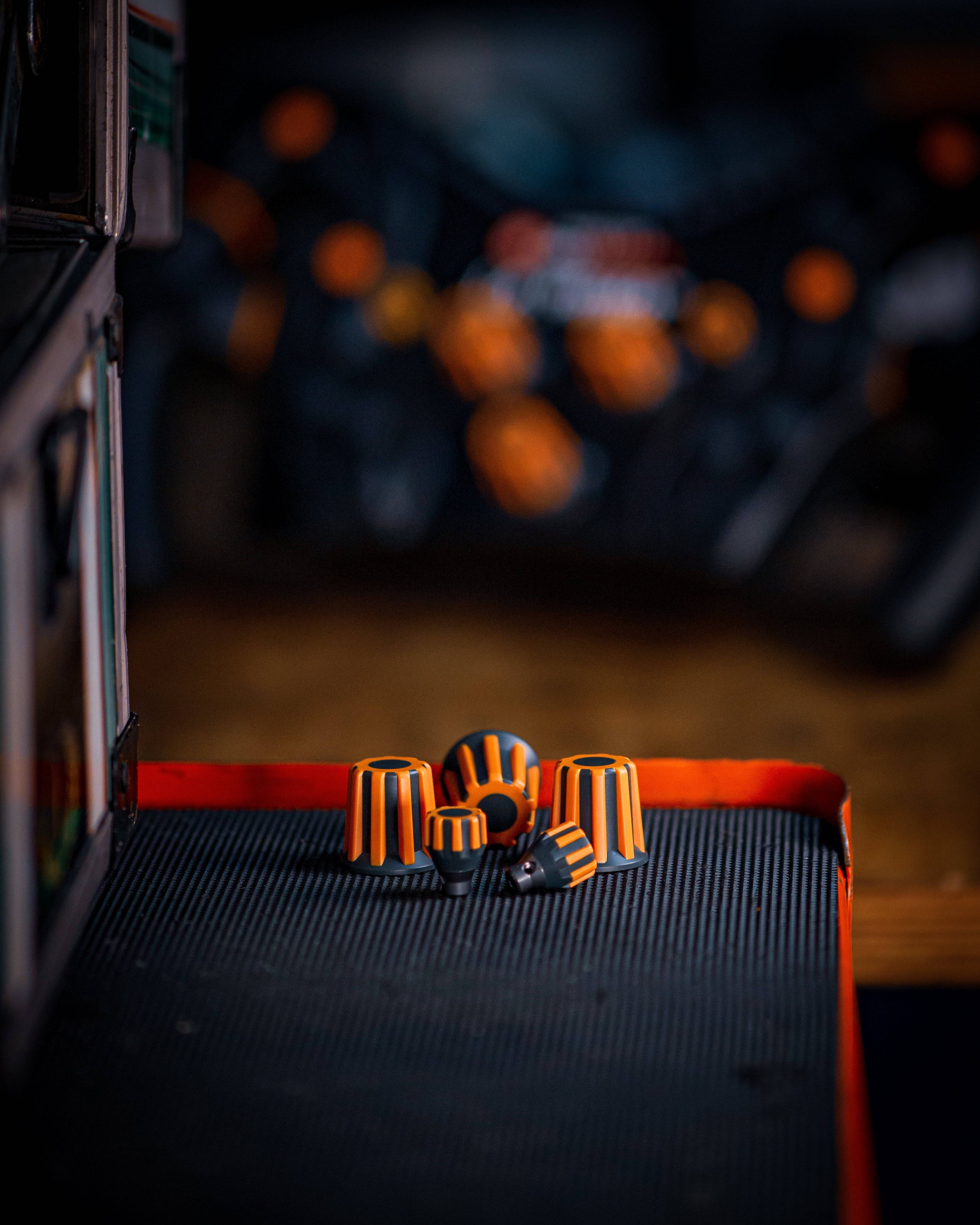 Asetek SimSports Forte wheel rim with orange buttons, encoders, and a 7-way switch for racing simulation accessories.